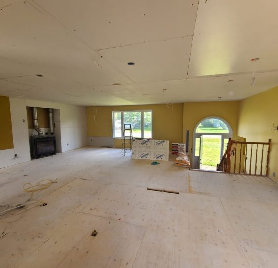 Contemporary kitchen with marble countertops and stainless steel appliances by Prime Built