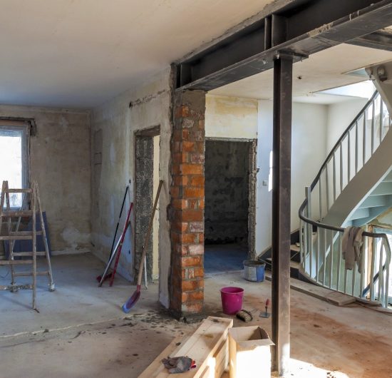 Contemporary living room with fireplace, plush seating, and stylish decor designed by Prime Built